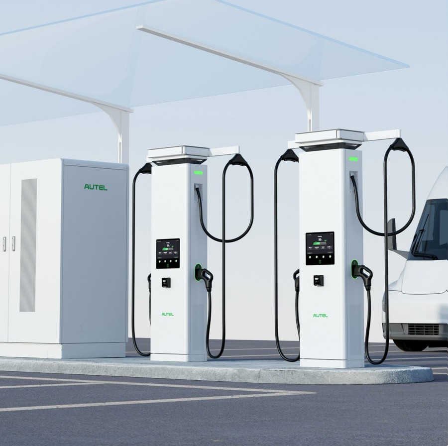 Autel MaxiCharger DC HiPower charging system with two dispensers under canopy, power cabinet, and commercial van